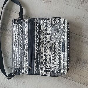 Sakroots Artist Circle Crossbody Bag in Black White One World Peace